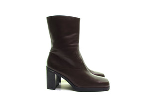 Vintage 90s Tommy Hilfiger brown leather boots with a square toe and super chunky heel. Available at vintage 90s.com