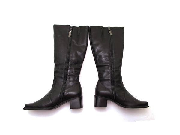 Tall chunky heel vintage 90s leather boots in black.