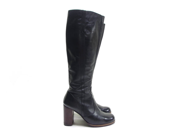 Vintage 70s knee high black leather hippie boots with a platform sole and high chunky heel.